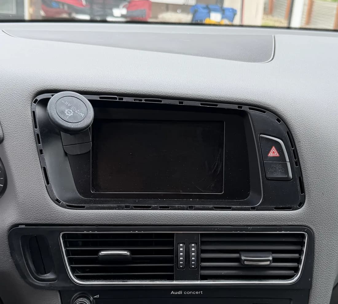 2011 Audi Q5 dashboard before the upgrade, with the small factory screen