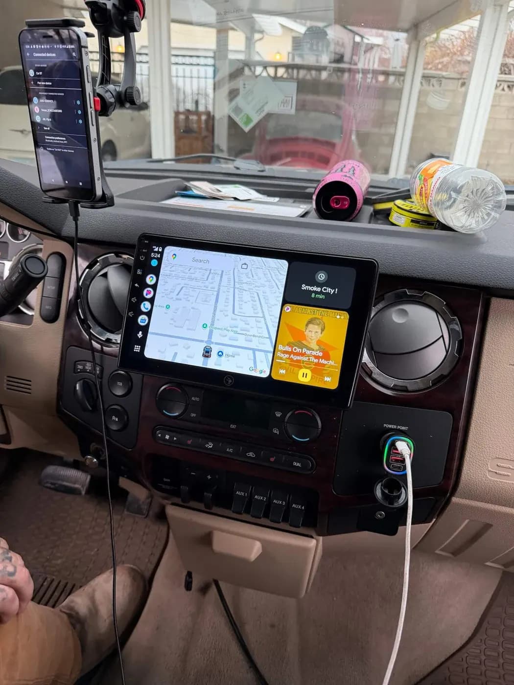 Installed radio showing navigation in a vehicle with circular dashboard vents